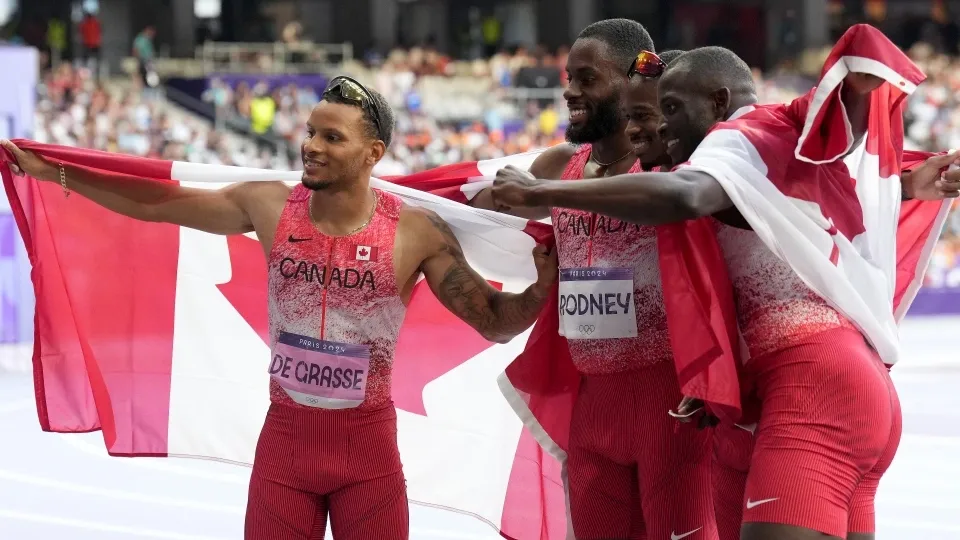 Canada's men's 4 x 100m relay team, from left to right, Andre De Grasse, Brendon Rodney, Aaron Brown and Jerome Blake celebrate their gold medal finish during the Paris Summer Olympics in Saint-Denis, France, Friday, Aug. 9, 2024. THE CANADIAN PRESS/Nathan Denette